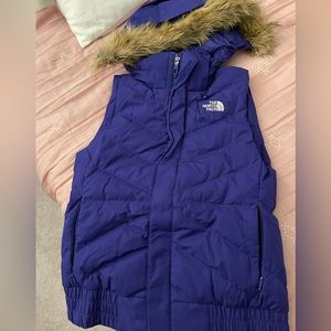 Royal blue Northface puffer vest with detachable fur hood.